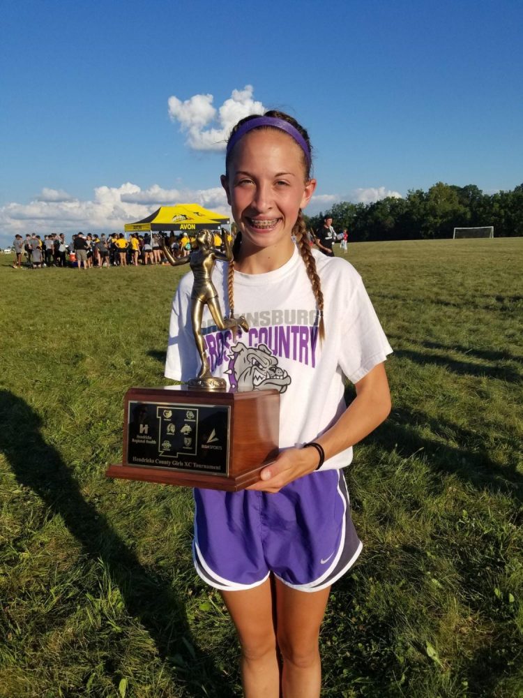 Freshman+Abby+Lynch+with+her+County+Champ+trophy.+%0APhoto+courtesy+of+%40BHSDogsgirlsxc