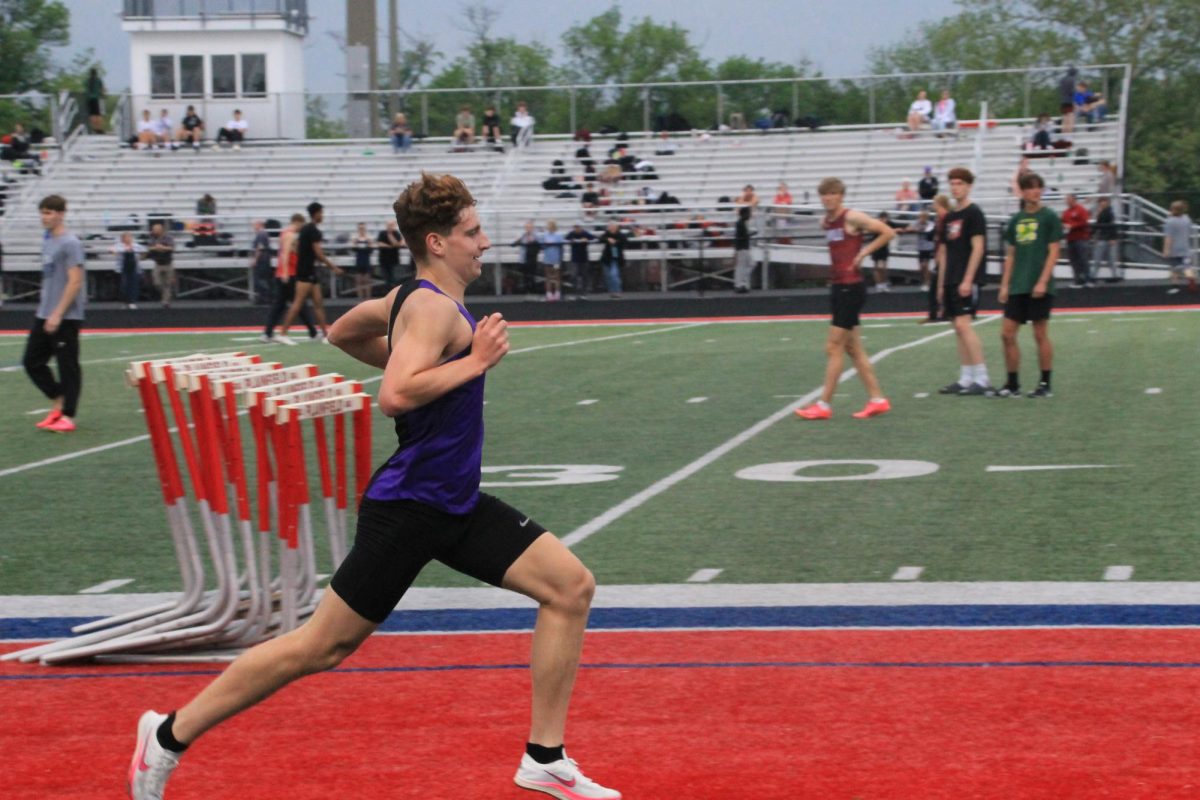 Junior+Ian+Baker+kicks+to+the+finish+line+to+win+the+1600+at+sectionals%2C+qualifying+for+regionals.+Baker+broke+the+1600+meet+record+that+he+set+last+season%2C+running+a+time+of+4%3A20.63.+