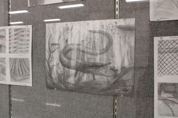 Picture of Derringer’s art displayed out in front of the art classes. 