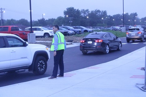 Interim Principal Tom Balitewicz helps keep traffic going at Door 6 on August 7, 2024. 